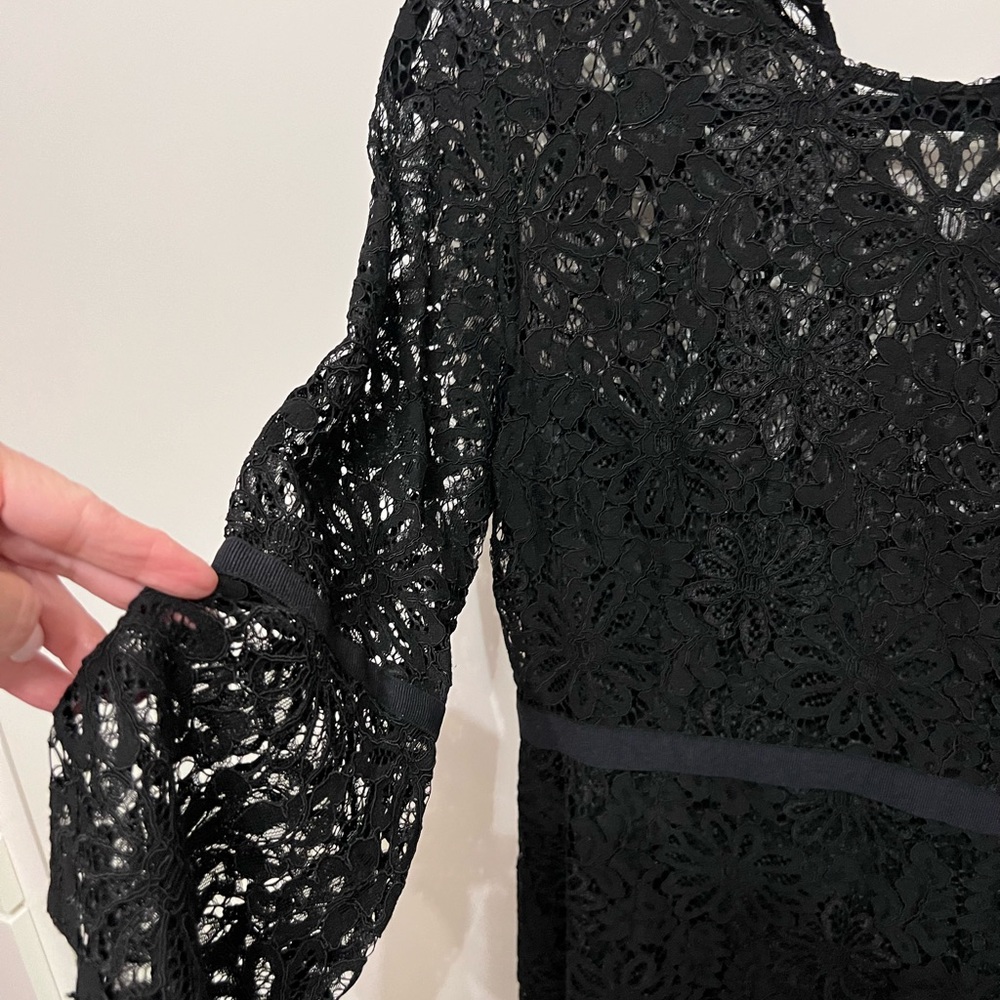 Knee length lace dress.